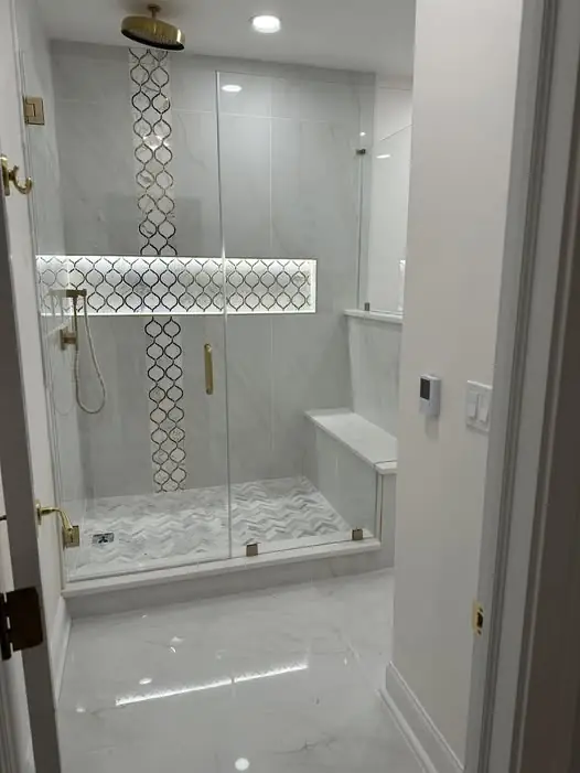 Marble frameless shower with brass hardware